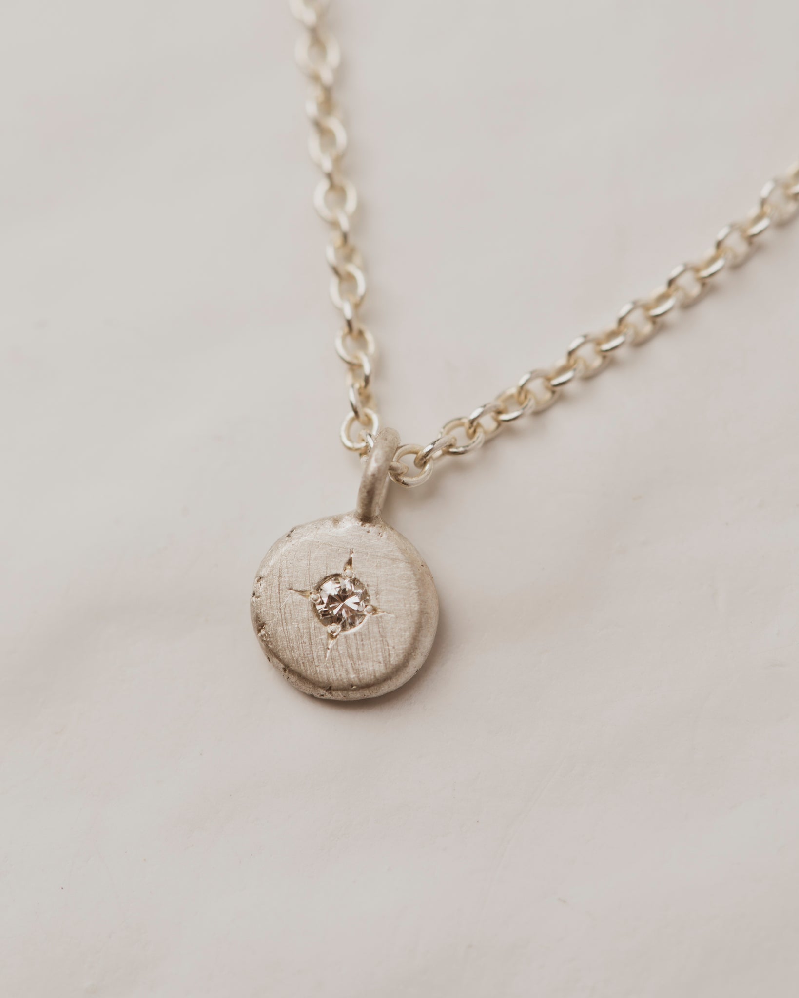 White diamond pebble necklace in sterling silver