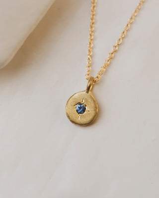 18K Yellow gold pebble necklace with 2mm montana sapphire center