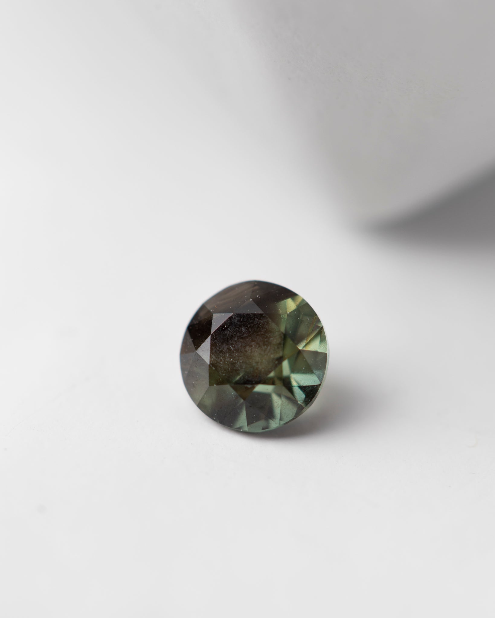 0.8 carat Dark Green Round Sapphire