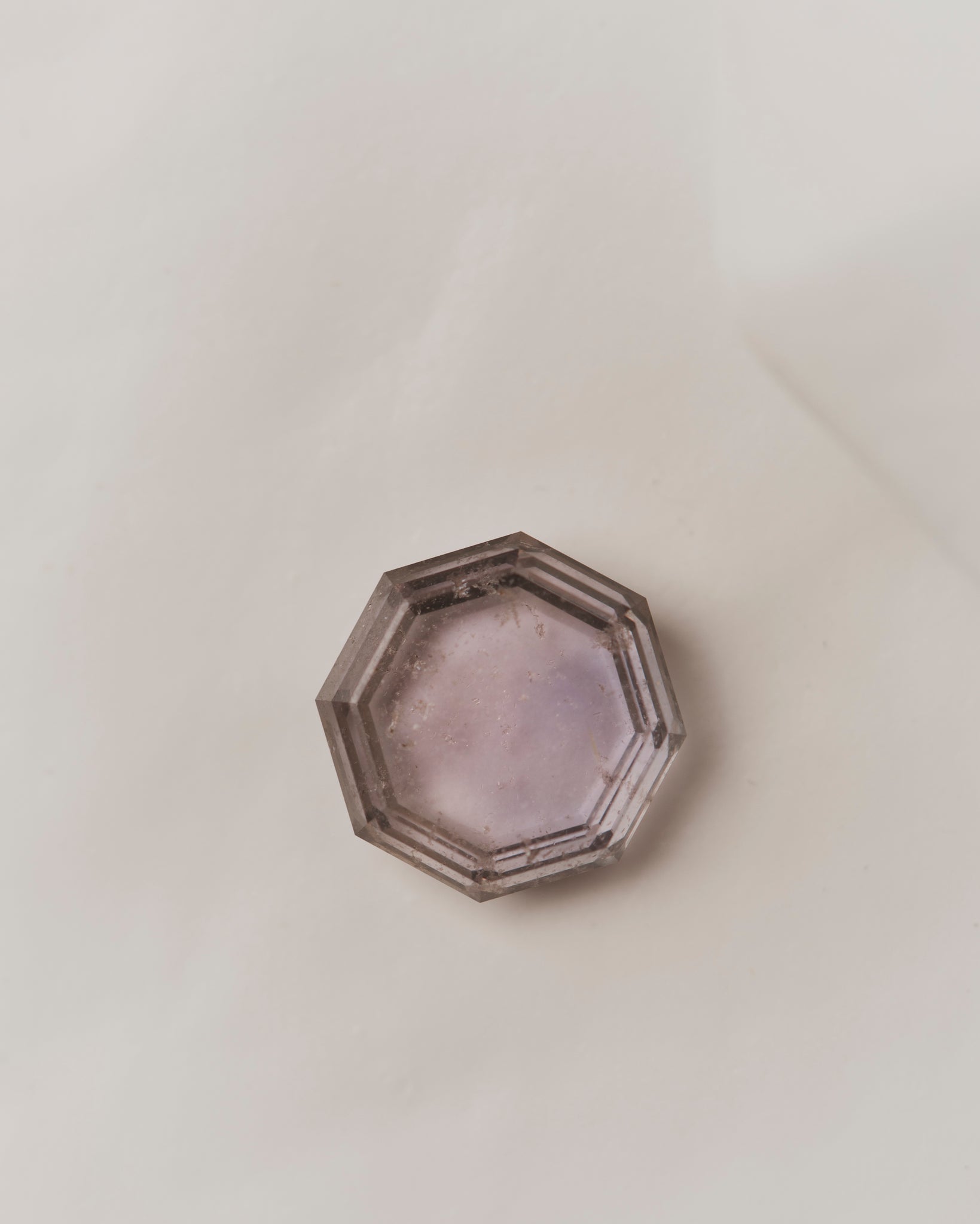 This 3.56 carat Rose hued tablet-cut Montana Sapphire is a hexagon shape