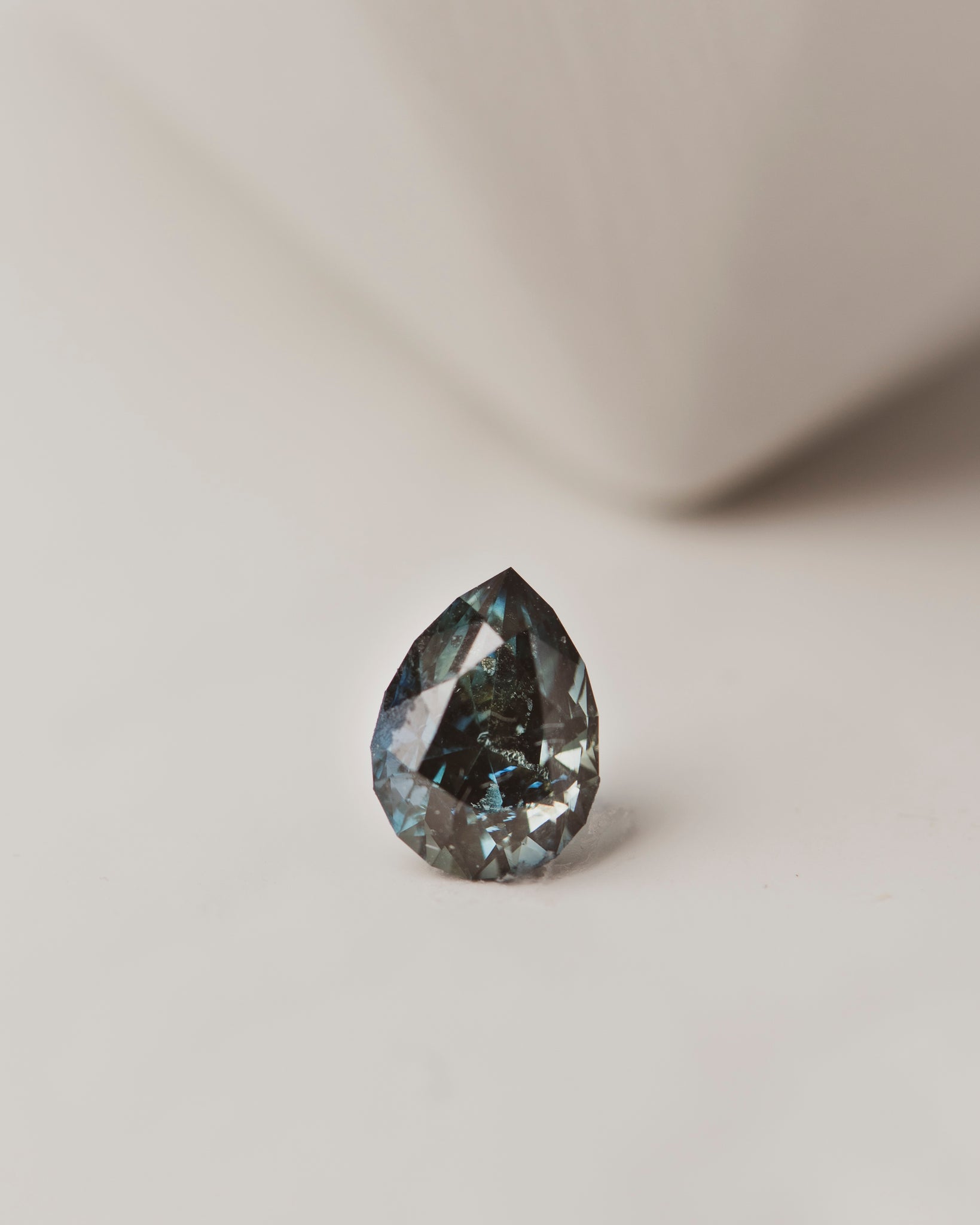 This 1.4 carat blue-green sapphire is pear cut and was responsibly mined in Nigeria, perfect for a custom engagement ring