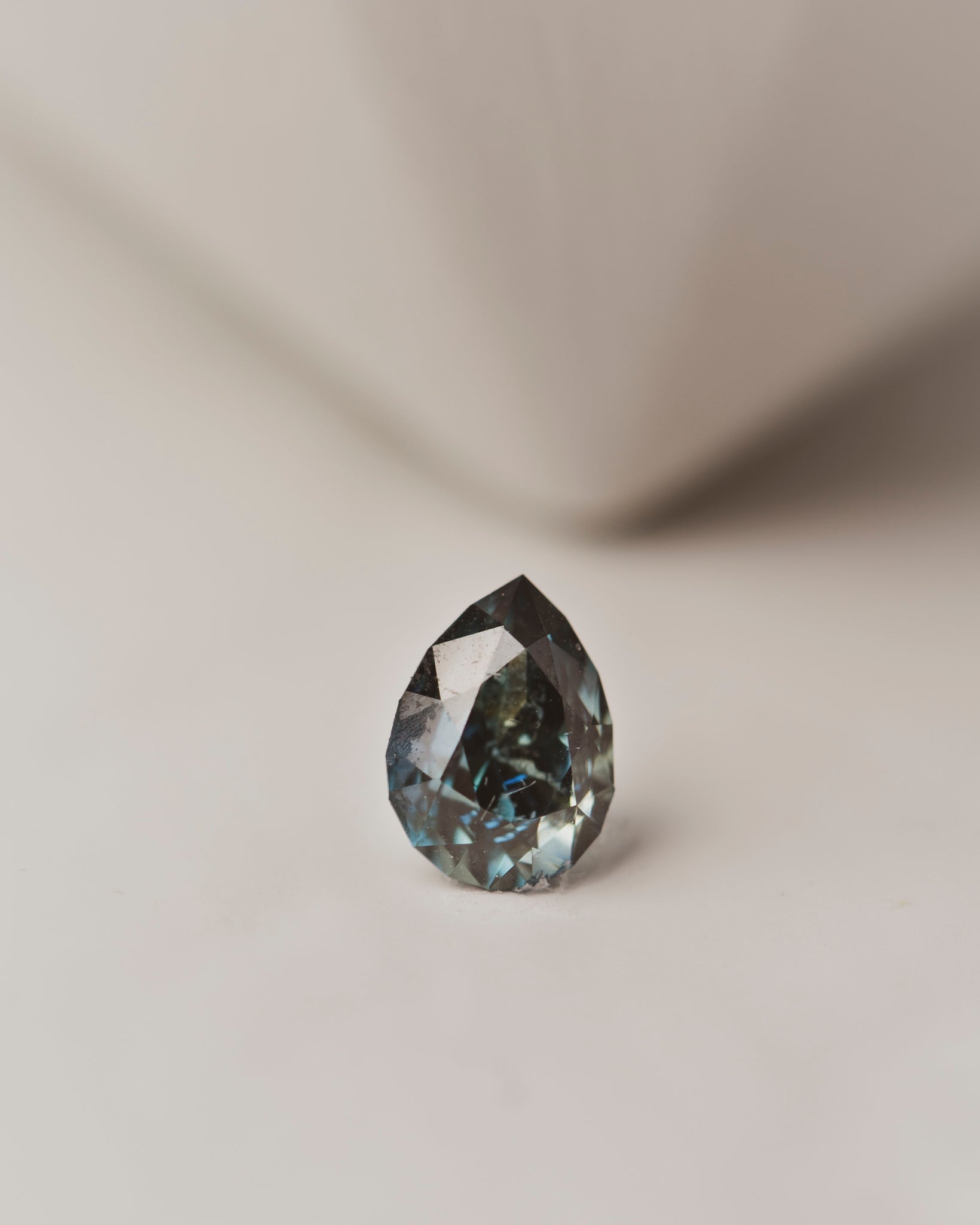 This 1.4 carat blue-green sapphire is pear cut and was responsibly mined in Nigeria, perfect for a custom engagement ring