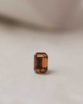 This 1.2 carat Emerald Cut Umba Sapphire has a striking dark bronze hue, perfect for a custom design