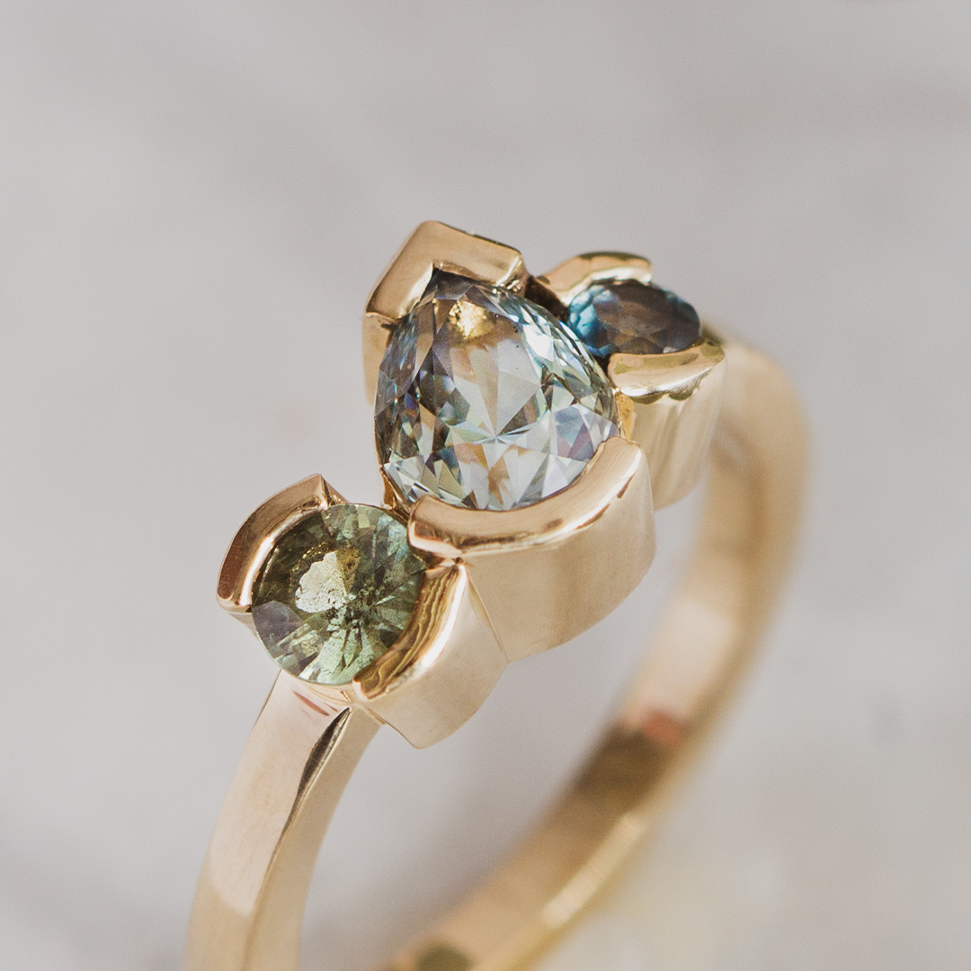 Montana sapphire three stone engagement ring in gold