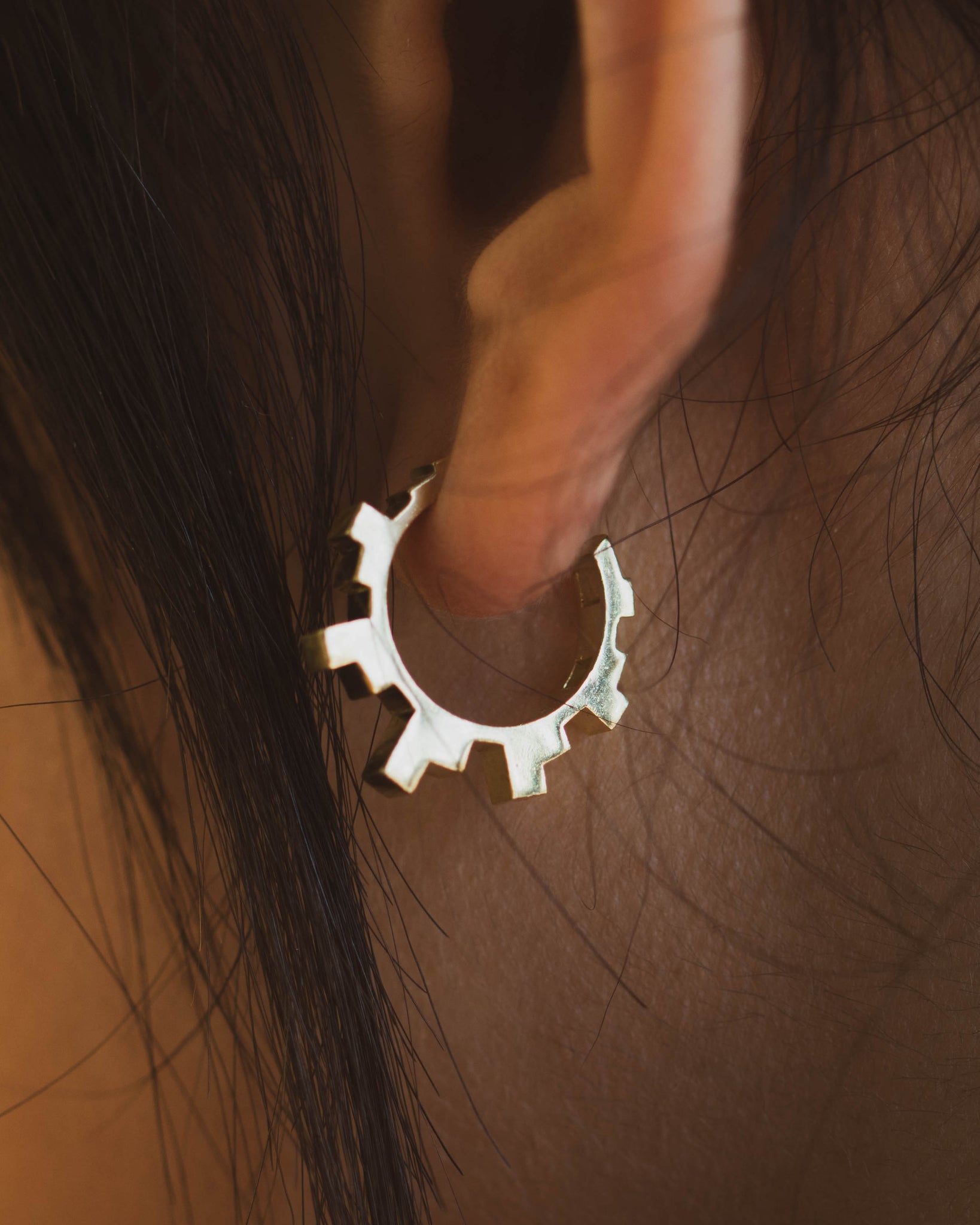 Gold Art Deco Hoop Earrings on model's ear