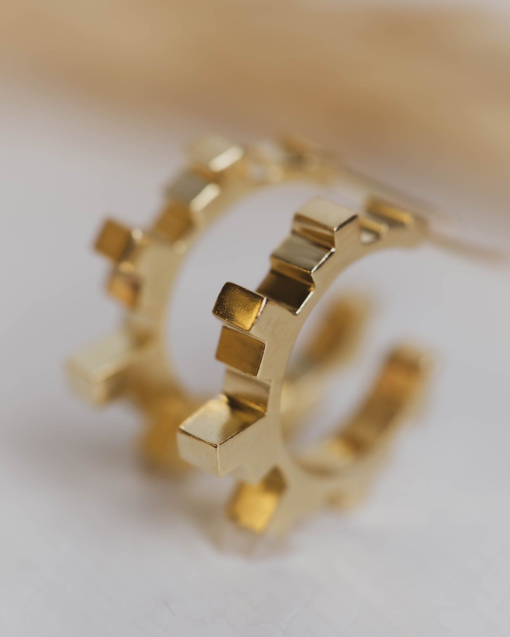 Detail of Gold Art Deco Hoop Earrings