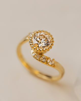 1.41 carat lab grown diamond engagement ring in rose vine bezel setting with accent diamonds in 18K yellow gold