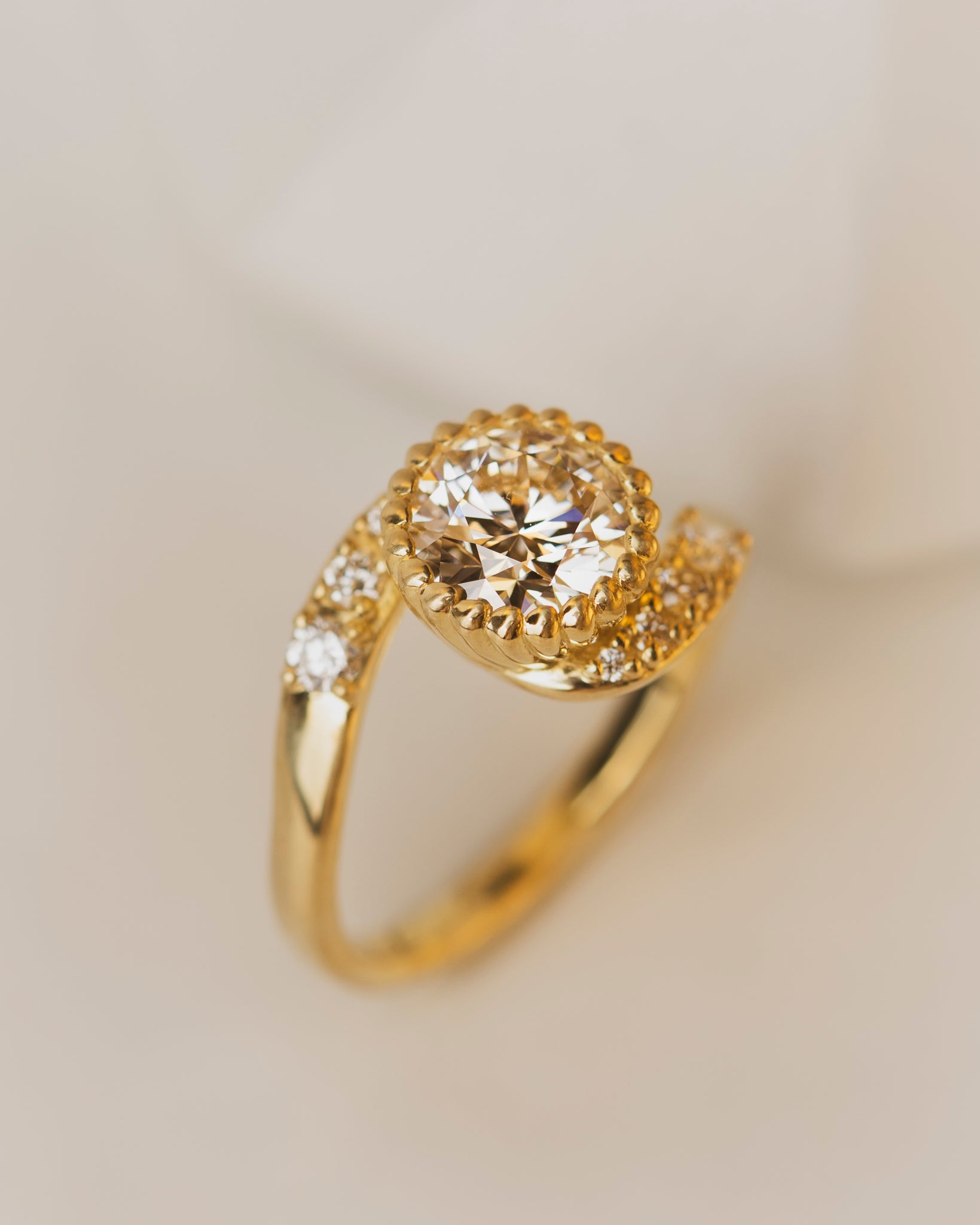 1.41 carat lab grown diamond engagement ring in rose vine bezel setting with accent diamonds in 18K yellow gold