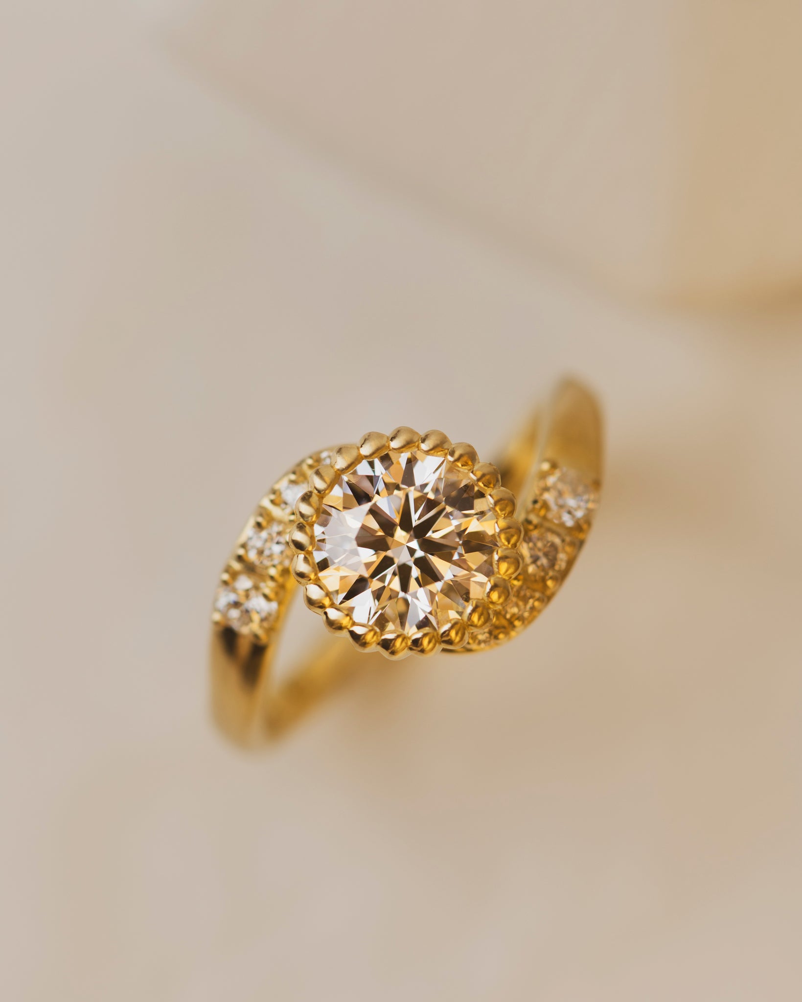 1.41 carat lab grown diamond engagement ring in rose vine bezel setting with accent diamonds in 18K yellow gold