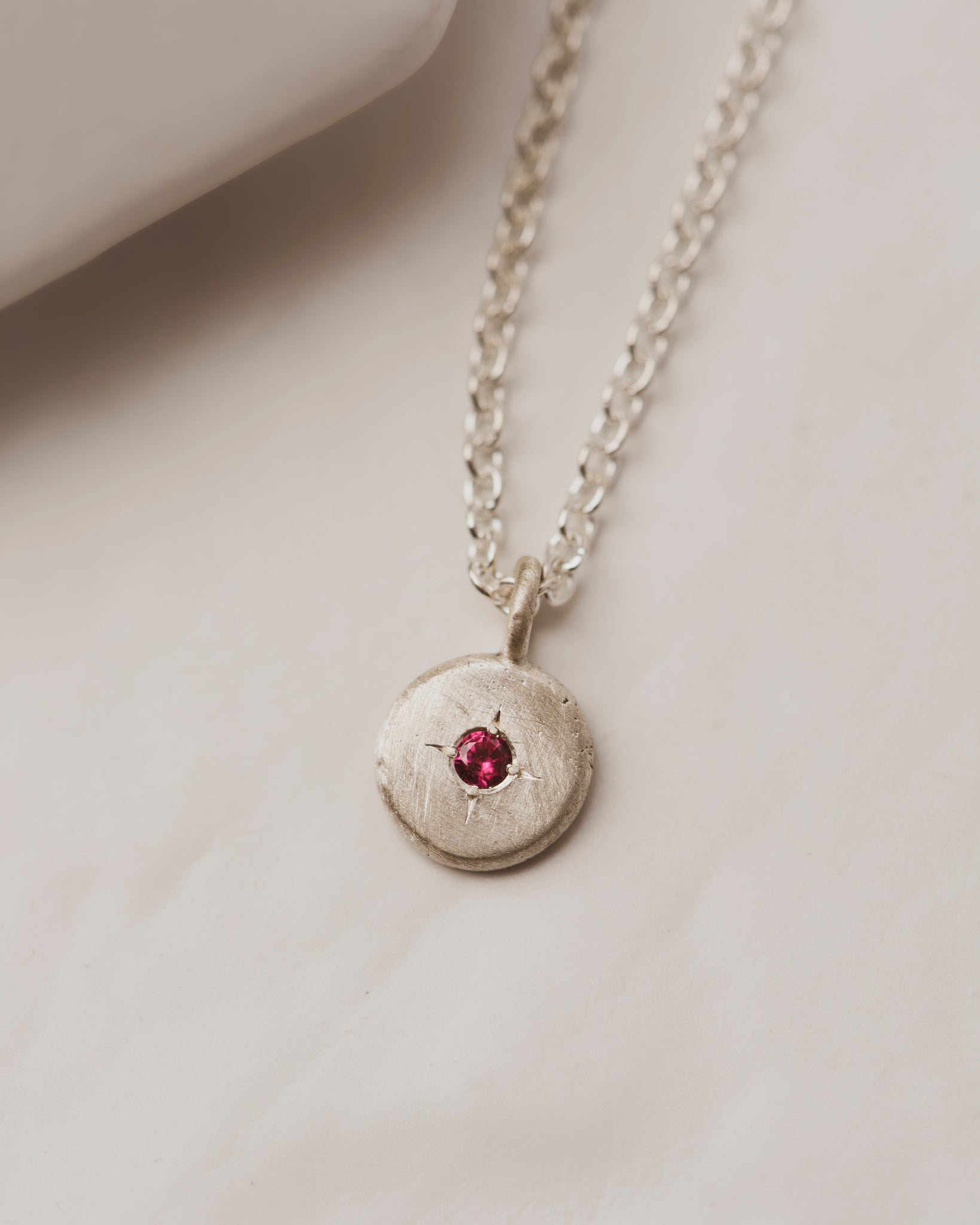 Sterling Silver pebble necklace with 2mm ruby in the center