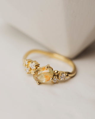 Oval yellow dot sapphire cluster ring with 5 white diamonds