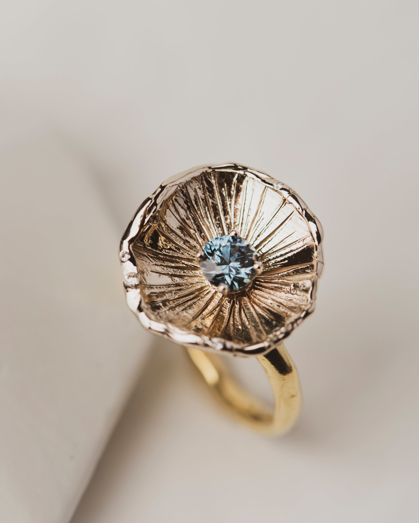 One of a kind 18K White Gold Flower Petal Ring with 0.67 carat Montana Sapphire on band of 18K yellow gold