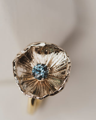 Top view of One of a kind 18K White Gold Flower Petal Ring with 0.67 carat Montana Sapphire on band of 18K yellow gold