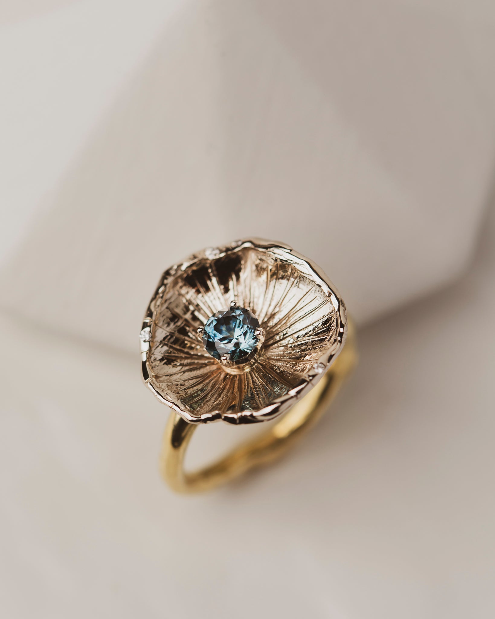 One of a kind 18K White Gold Flower Petal Ring with 0.67 carat Montana Sapphire on band of 18K yellow gold