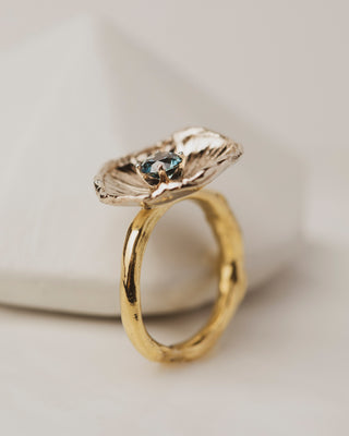 Side view of One of a kind 18K White Gold Flower Petal Ring with 0.67 carat Montana Sapphire on band of 18K yellow gold